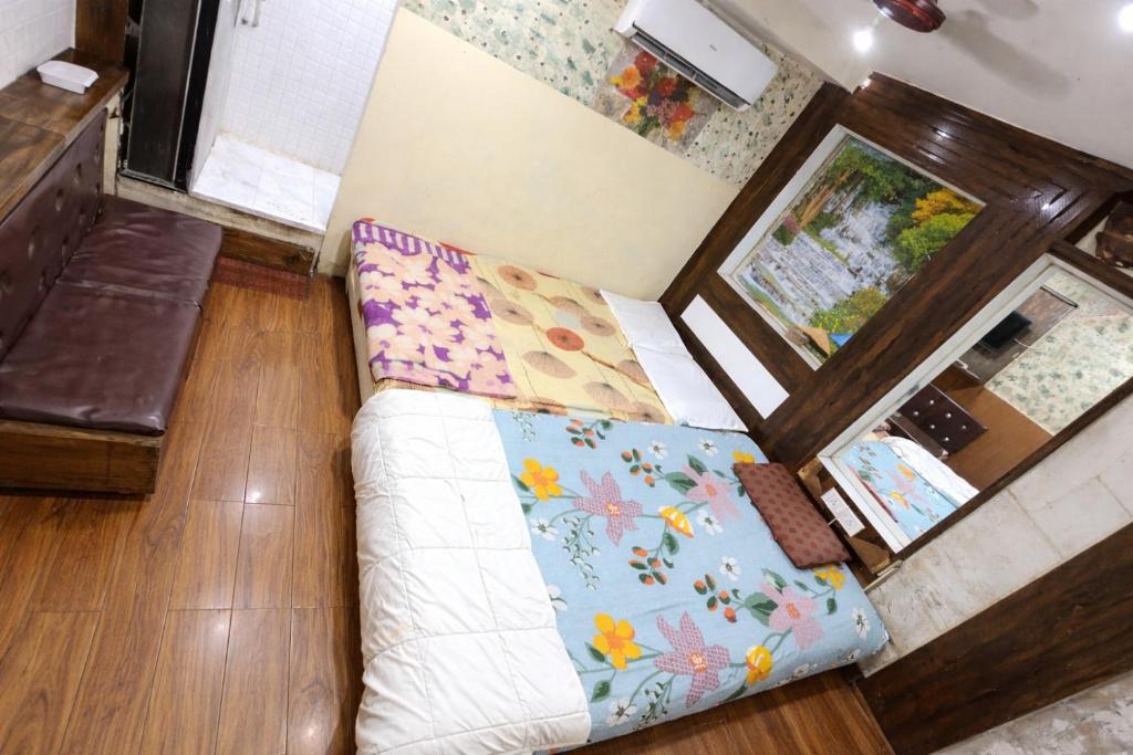 an overhead view of a living room with a couch at Hotel Shree in Indore