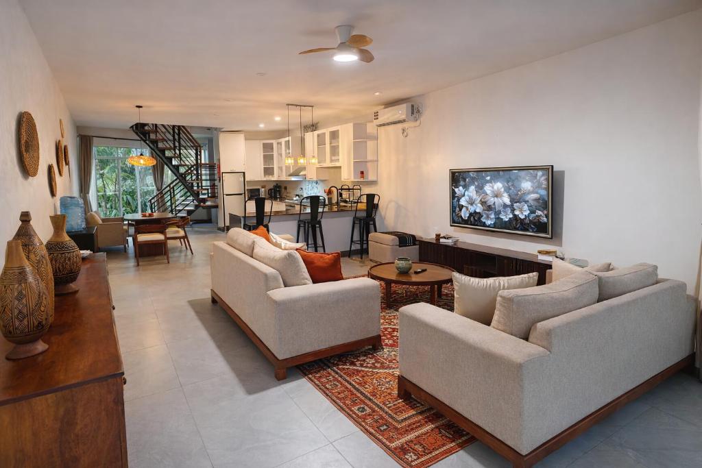 a living room with two couches and a living room with at Crystal Apartments in Malindi