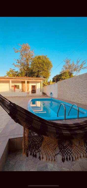 a large bath tub sitting on top of a patio at Casa de veraneio jacuma in Conde