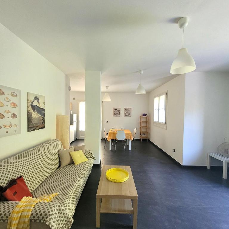 a living room with a couch and a table at Al Molino delle Ghiare in Levanto