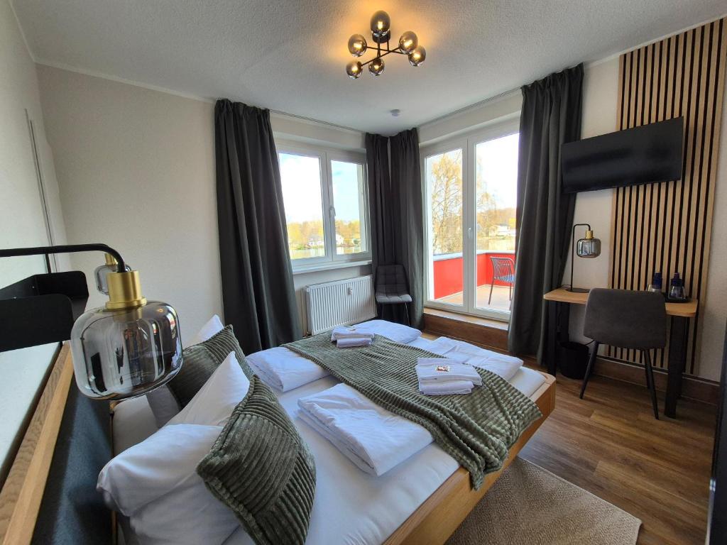 a bedroom with a bed and a window at Seehaus Miersdorf in Zeuthen