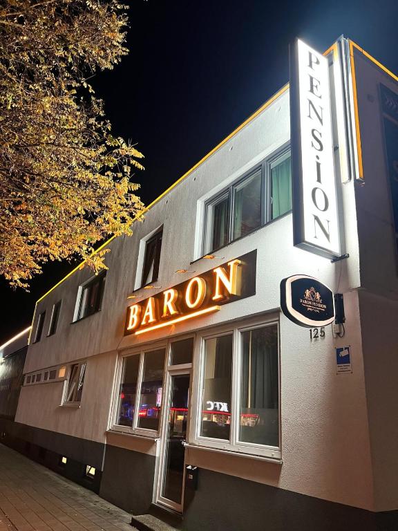 a building with a sign that reads baron at Pension Baron in Fürth