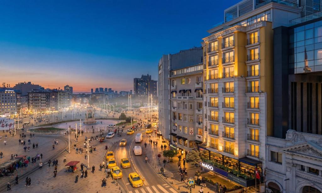 a city street at night with traffic and buildings at CVK Taksim Hotel Istanbul in Istanbul