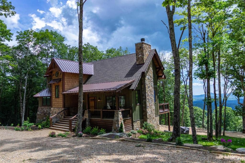 a house in the woods with trees at Longview at Eagles Nest in Elk Park