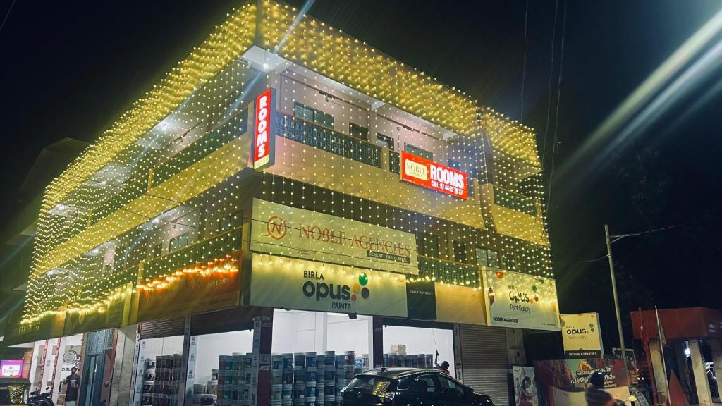 a building with a lot of lights on it at Noble Darshan in Guruvāyūr