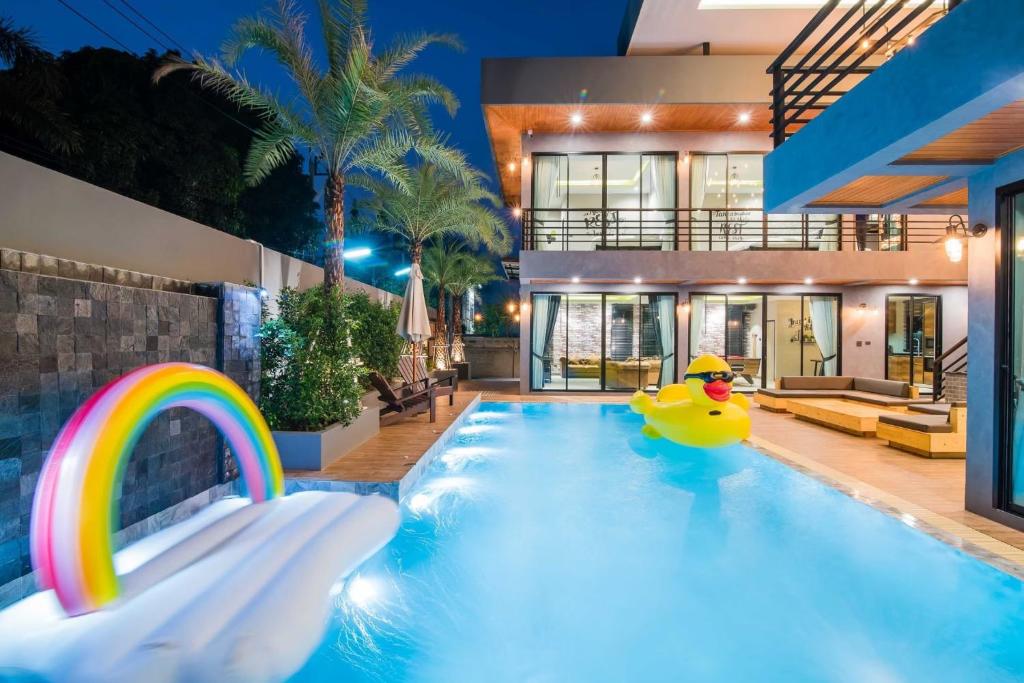 a pool with a rubber duck in the middle of a house at Playa Huahin by Ying in Hua Hin