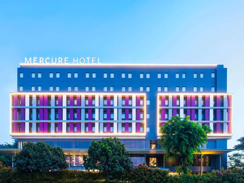 a rendering of a hotel with colorful windows at Mercure Jakarta Grogol in Jakarta
