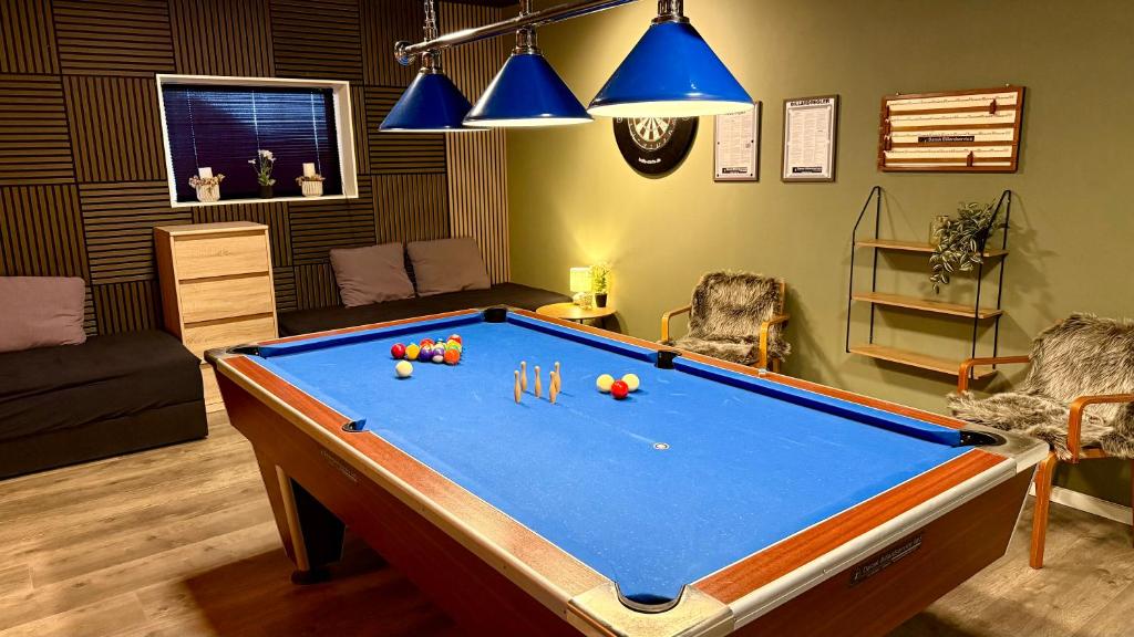 a living room with a pool table in it at Kastanjegaarden in Ansager