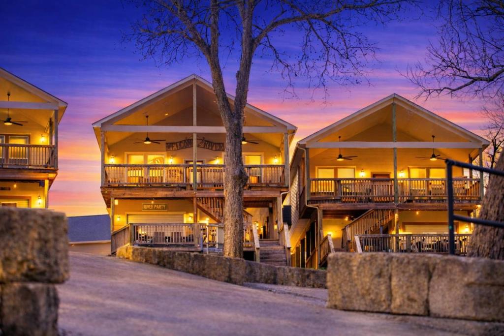 a building with balconies on the beach at night at River Road Villas #2 in New Braunfels