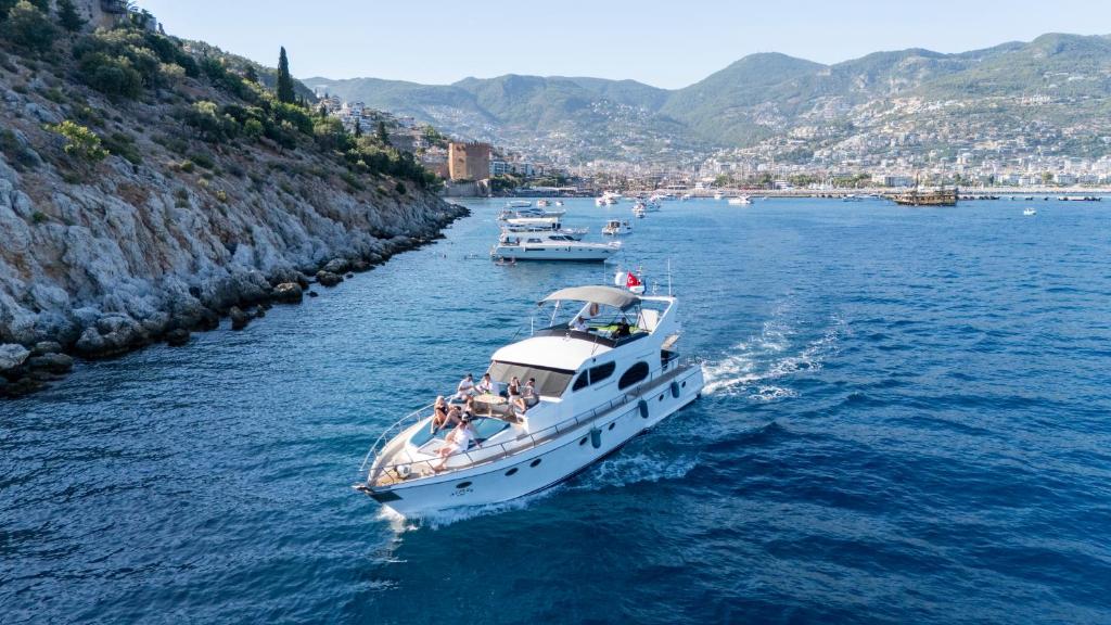 a group of people on a boat in the water at vip motoryat in Alanya