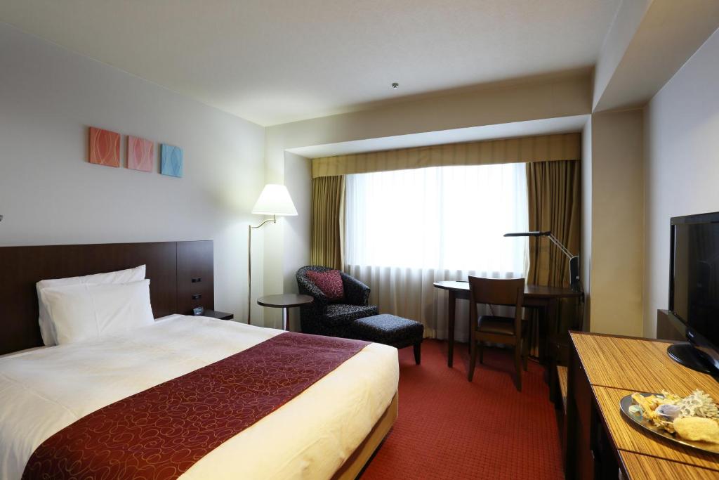 Postel nebo postele na pokoji v ubytování Loisir Hotel Toyohashi