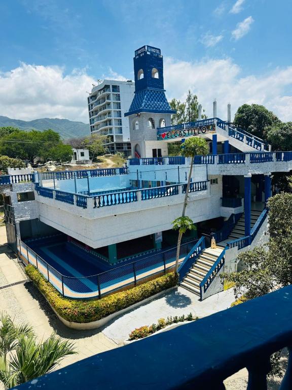 a blue and white building with stairs and a tower at SGH Castillo Aqua in Santa Marta