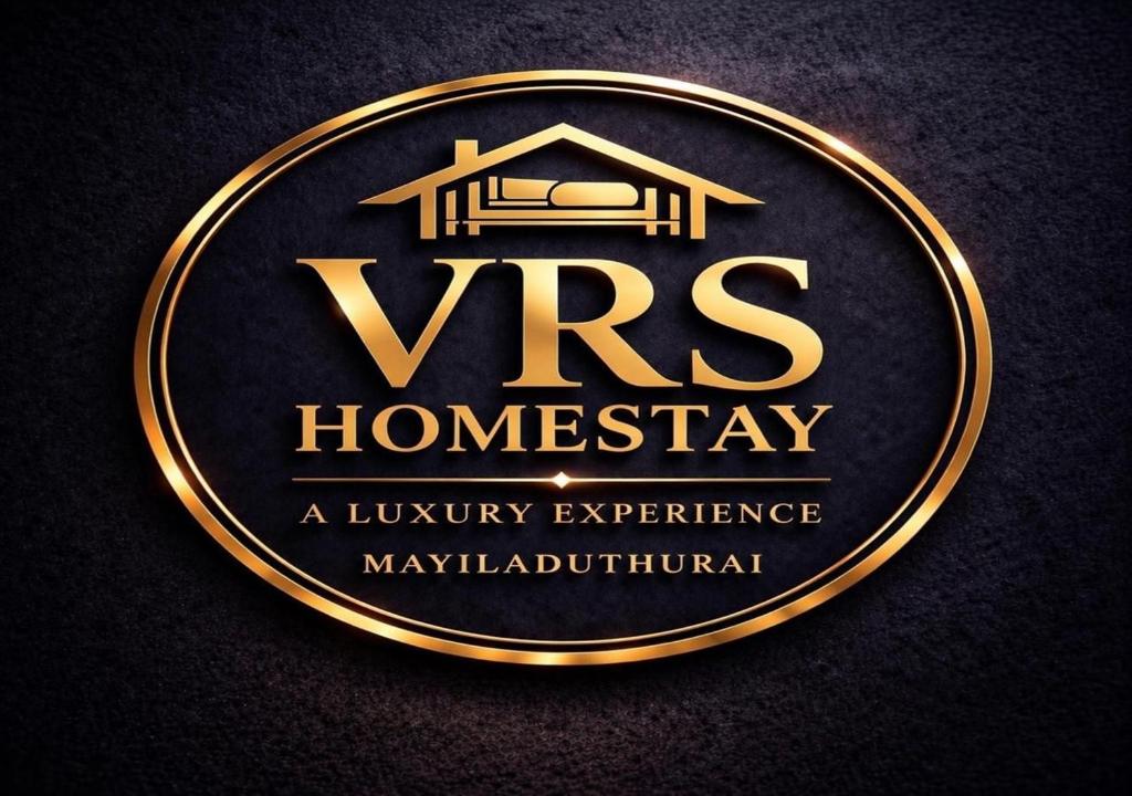 a gold plaque with the words vrs homeway and auryury experience at Vrs Homestay in Mayiladuthurai