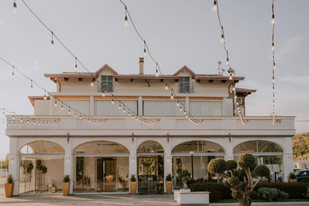 a large white building with christmas lights at Relais San Giorgio in Pignataro Maggiore