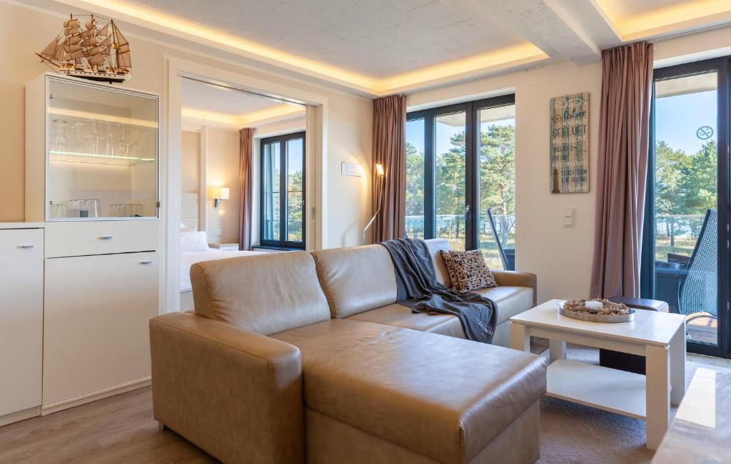 a living room with a couch and a table at Prince in Binz