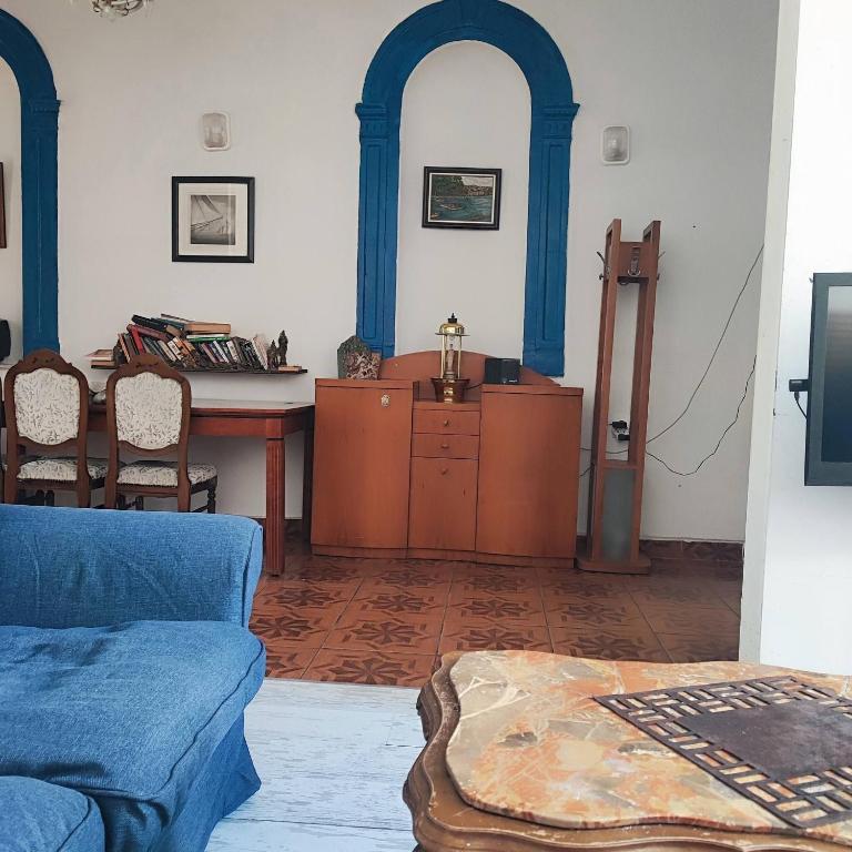 a living room with a couch and a table at Historical House in Alsancak in Konak