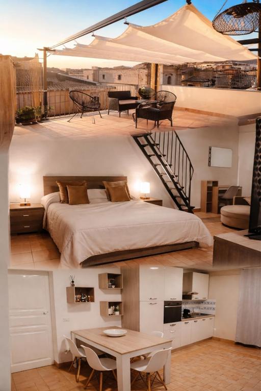 two images of a bedroom with a bed on a deck at Appartamento Gold in Centro - Privitera Rooms & Apartments in Grammichele