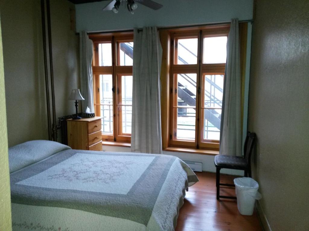Una cama o camas en una habitación de L'intendant