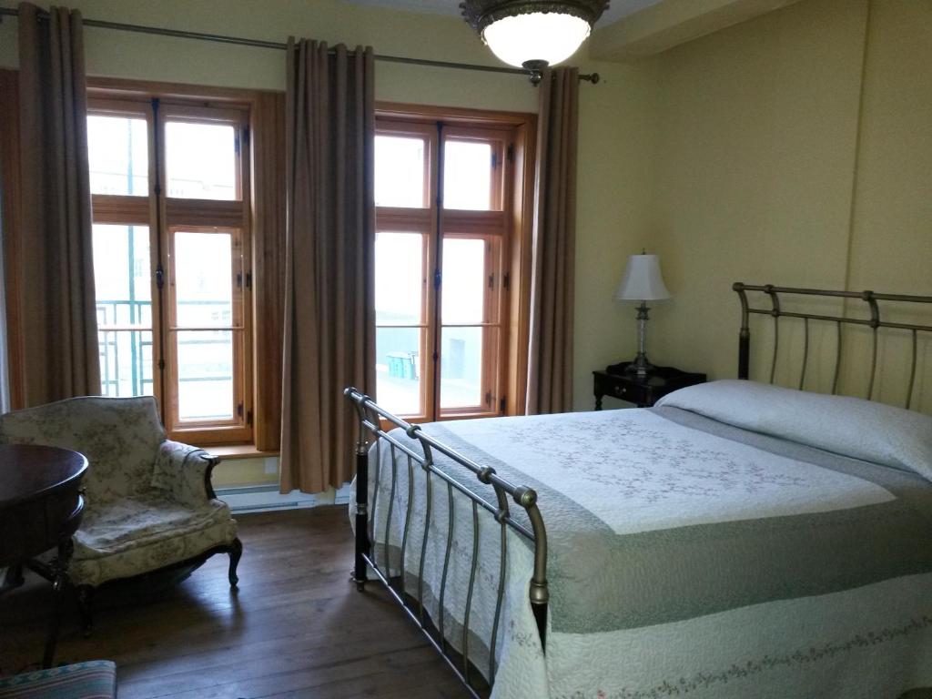 Una cama o camas en una habitación de L'intendant