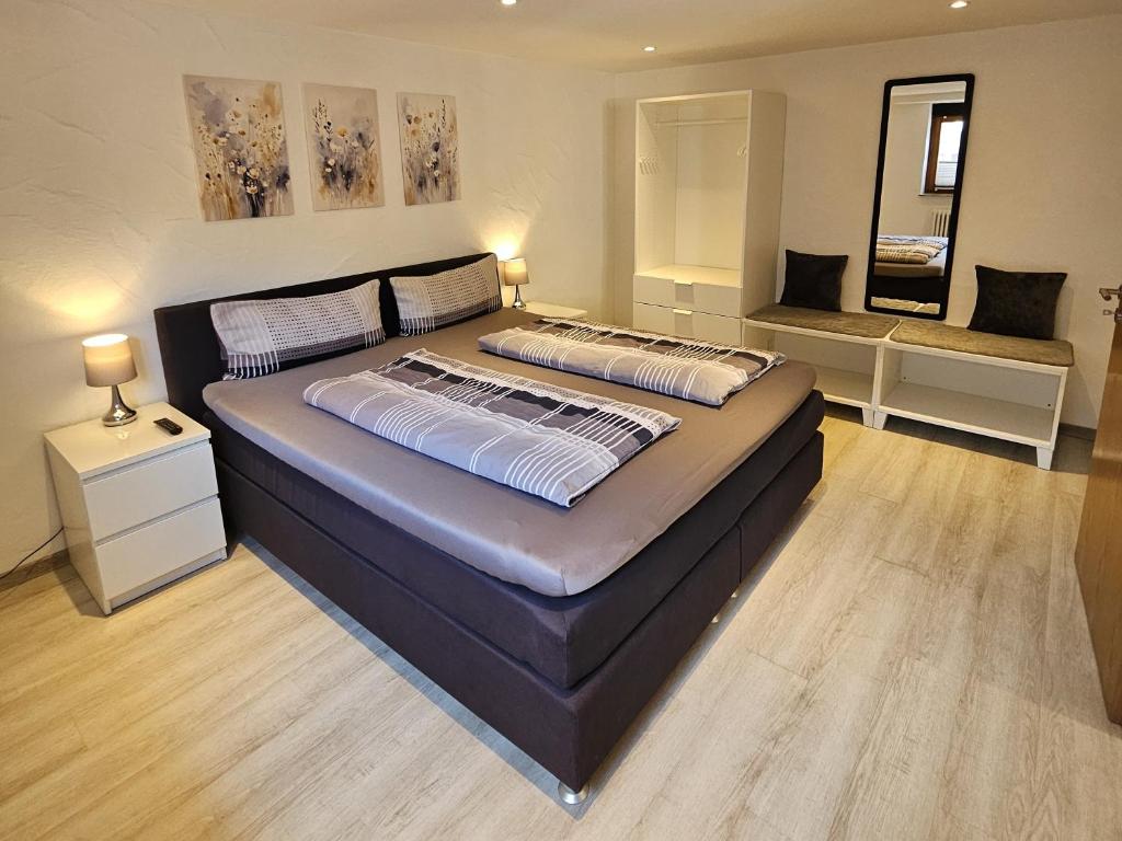 a bedroom with a large bed in a room at Ferienwohnung Alina in Rust