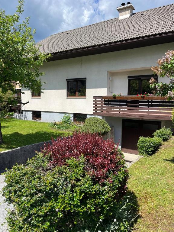 a house with a bench on top of it at Mountain View Mojstrana in Mojstrana