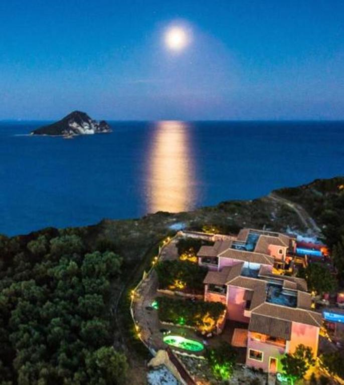 an aerial view of an island in the ocean at night at Athenea Villas, Private Pools & Gardens in Keri