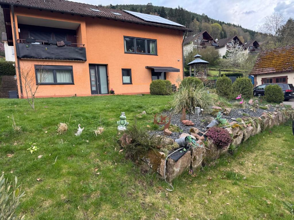 a garden in front of a house with lots of plants at Viva la Wildbad in Bad Wildbad
