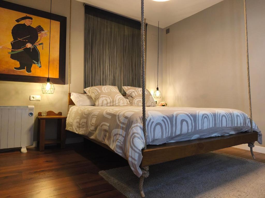 a bedroom with a swing bed in a room at ChâtEscos - Estudio en Château in Escos