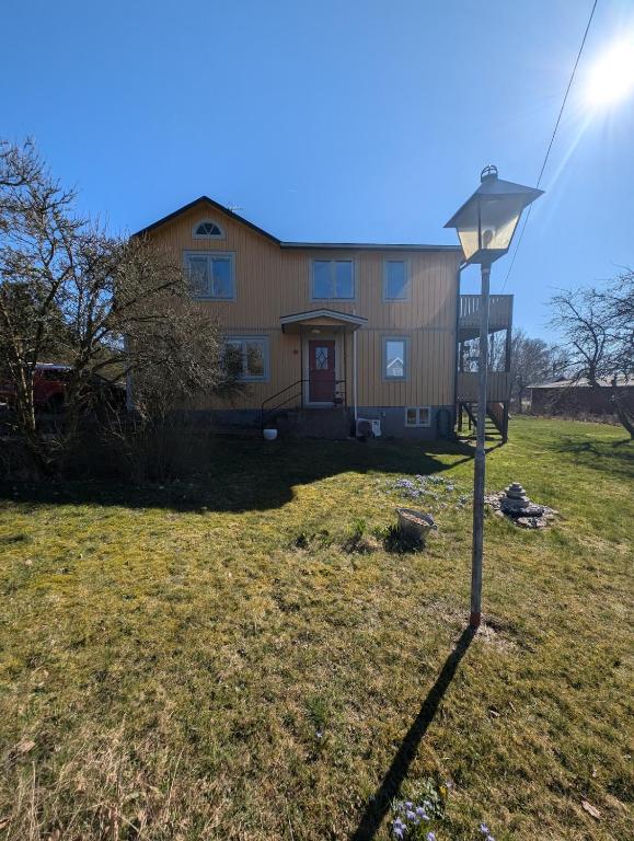 a house with a street light in the yard at Steneryd Salongen in Karlskrona