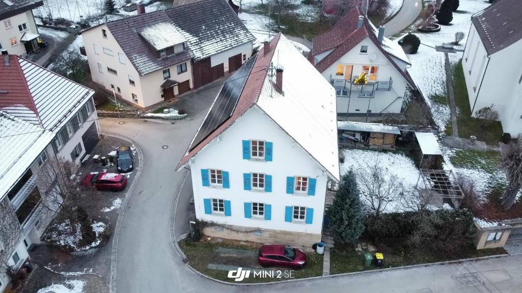 an aerial view of a white house in a city at Ferienwohnung Altes Pfarrhaus in Blumberg