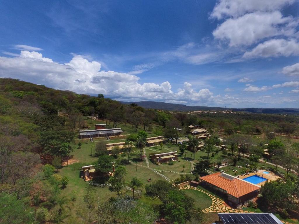 an aerial view of a resort with a pool and trees at Rancho Cipo Pousada in Serra do Cipo
