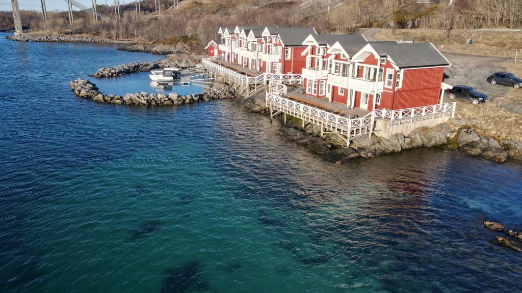 an aerial view of a house in the water at Sjøhus ved Tjeldsundet - House by the sea in Evenskjer
