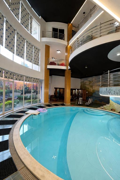 a large swimming pool in a hotel lobby at Villa Celia -New Cairo in Cairo