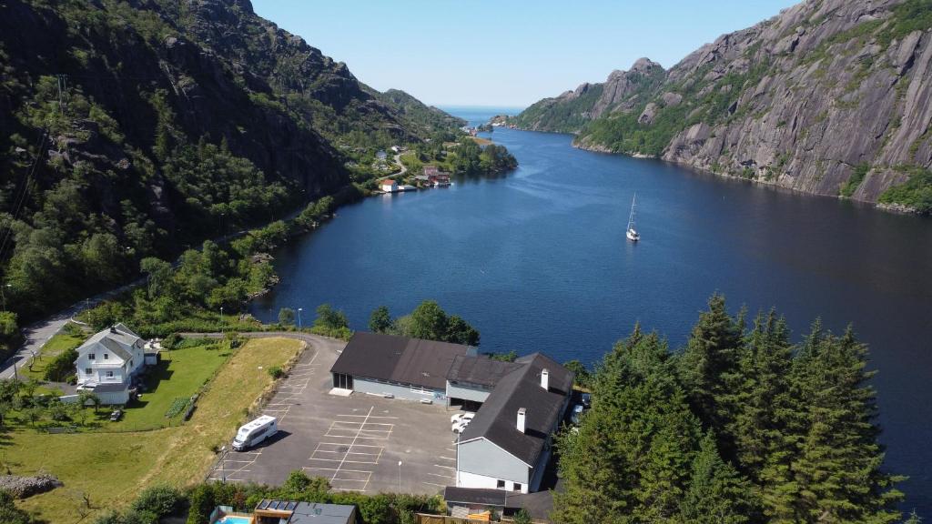 an aerial view of a lake with a boat in it at Brufjell Hostel & Parking in Flekkefjord