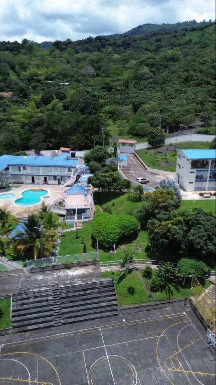 an aerial view of a building and a parking lot at Hotel Cabaleón in Tena