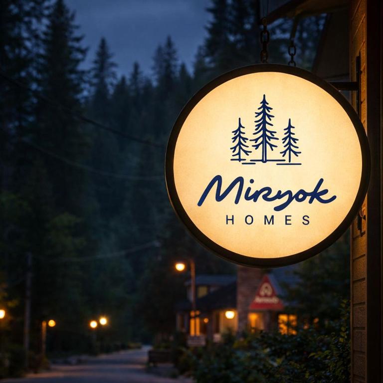a sign for a miyoke homes on the side of a building at Miryok Homes in Mirik
