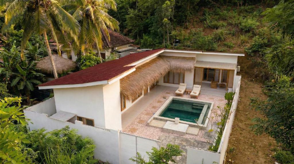 an aerial view of a house with a swimming pool at CASA Habibi in Kuta Lombok