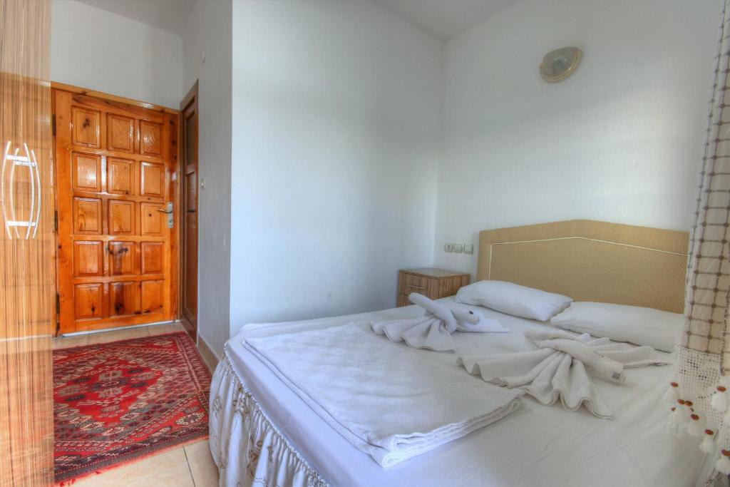 Postel nebo postele na pokoji v ubytování Baba Veli Pension