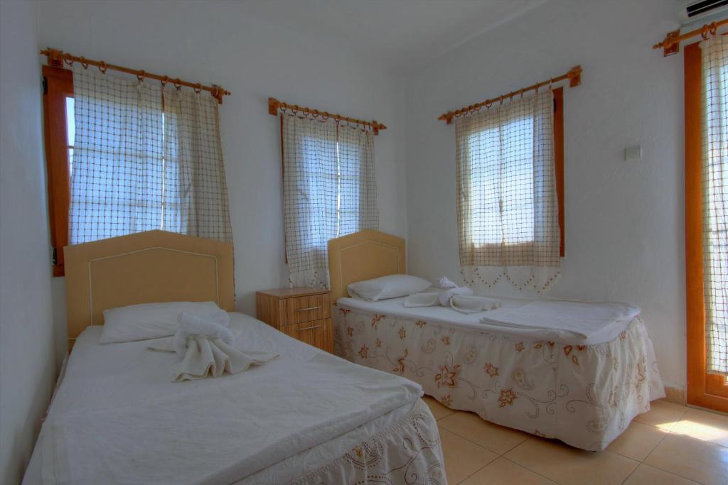 Postel nebo postele na pokoji v ubytování Baba Veli Pension