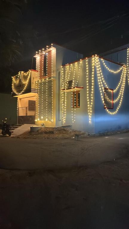 a building with christmas lights on the side of it at Bhuvanavasigal alayam in Tiruvannāmalai