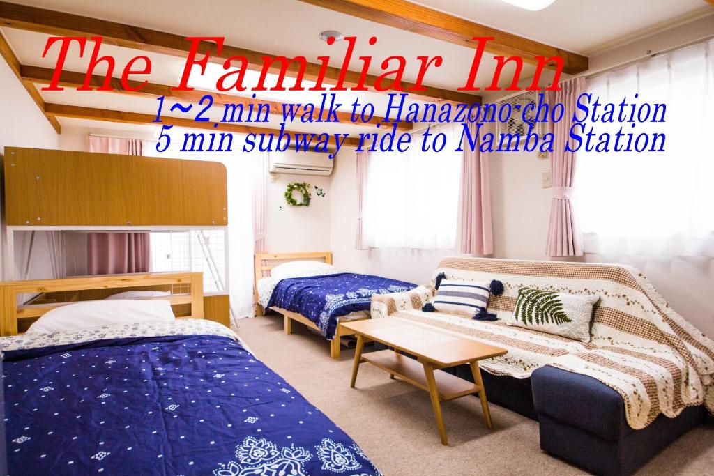 a dorm room with two beds and a couch at The Familiar Inn ー 2 min walk to subway, 5 min to Namba Station in Osaka