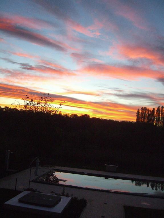 The sunrise or sunset as seen from a panziókat or nearby