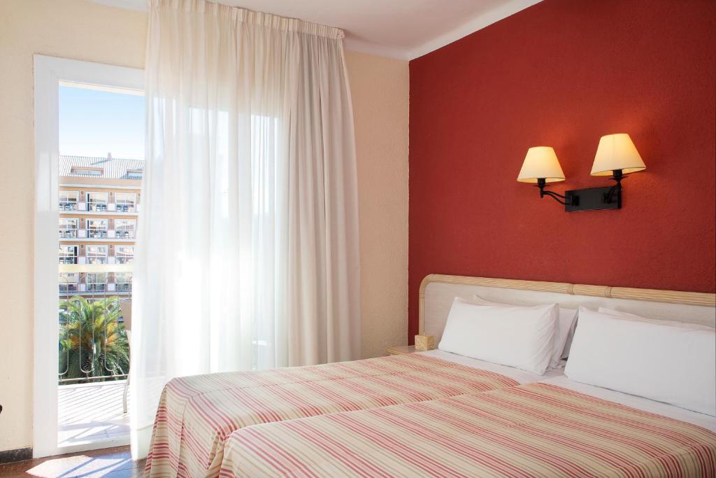 Cama o camas de una habitación en Luna Park Hotel Yoga & Spa