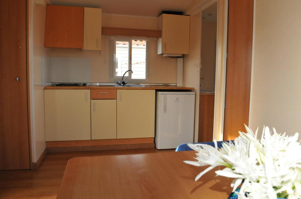 Kuchyň nebo kuchyňský kout v ubytování Abbatoggia Village