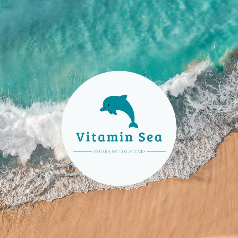 a logo for the vitamin sea on the beach at Vitamin Sea in Zahara de los Atunes
