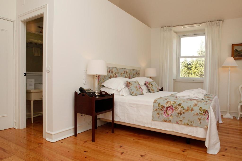 Кровать или кровати в номере Hotel Casa Palmela - Small Luxury Hotels of The World, Hotel & Villas