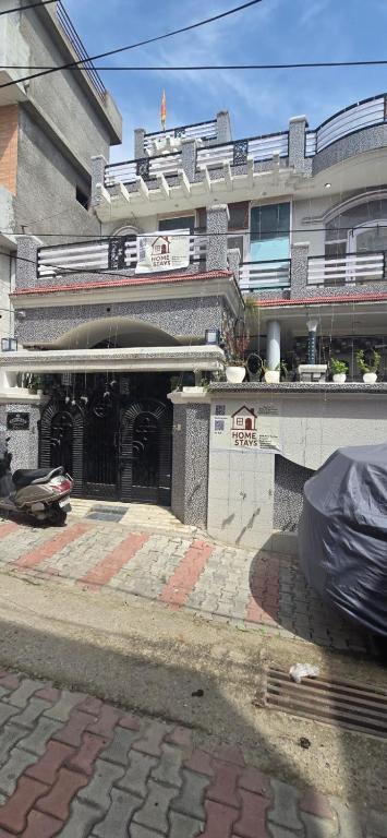 a building with a garage in front of it at Home stays 1bhk in Jammu