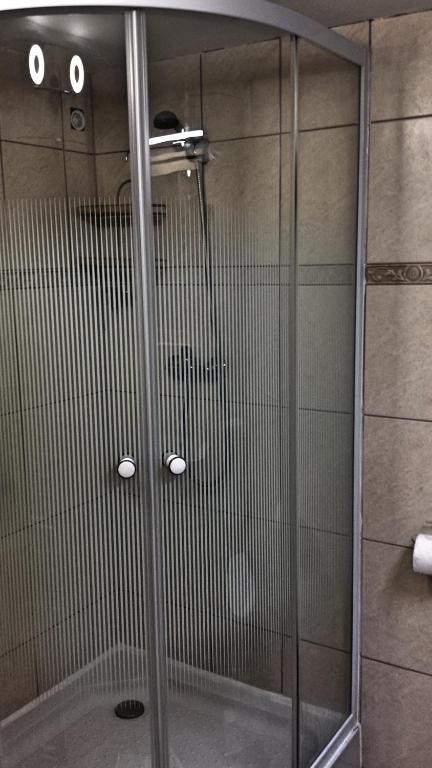 Kúpeľňa v ubytovaní Virág Apartmanház