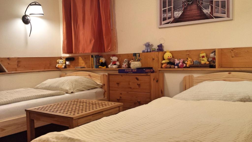Posteľ alebo postele v izbe v ubytovaní Virág Apartmanház