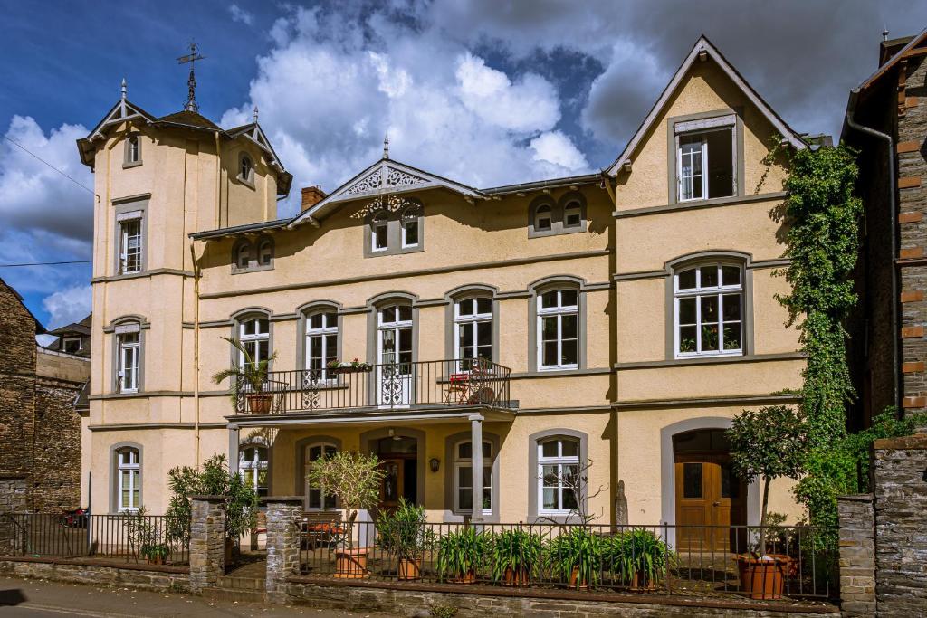 a large building with a cross on top of it at Villa Robert Heuser in Traben-Trarbach